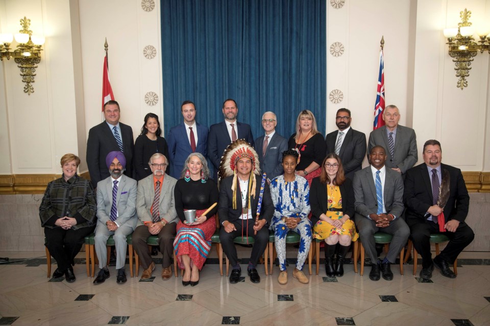Danielle Adams (front row, third from right) and 16 fellow NDP caucus members were sworn in as MLAs