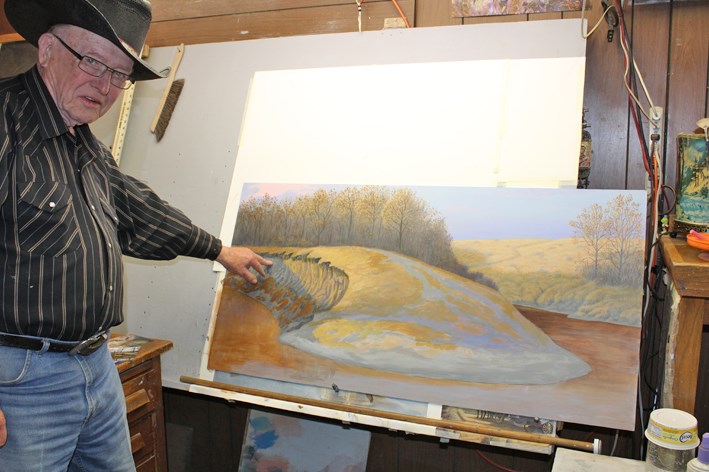 This large, unfinished oil painting is Terry McLean's latest project. With a line of bison, he will recreate the history of the Manitoba prairie. McLean points to the finding of a bison skull and skeleton in the bank as inspiration for this work.
