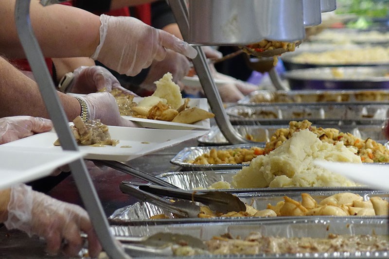 Red Cross volunteers from Thompson dished out free food for hundreds of hungry participants at Manitoba Keewatinowi Okimanak’s fall feast at the Thompson Regional Community Centre Oct. 10.