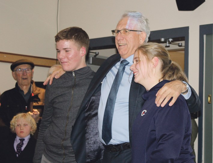 At election night victory celebration in the Brandon Riverbank Discovery Centre Maguire honours young supporters who helped in his door-knocking campaign, Quinnlan Andrew, 15 and Hannah Sharpe, 14.