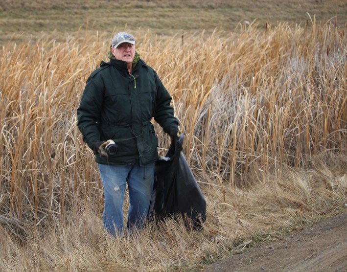 The first sign of action from the 13 Ways presentation by the community sustainability expert is Kelvon Smith, gathering garbage along Virden’s south highway Frontage Road, Monday, Nov. 18.