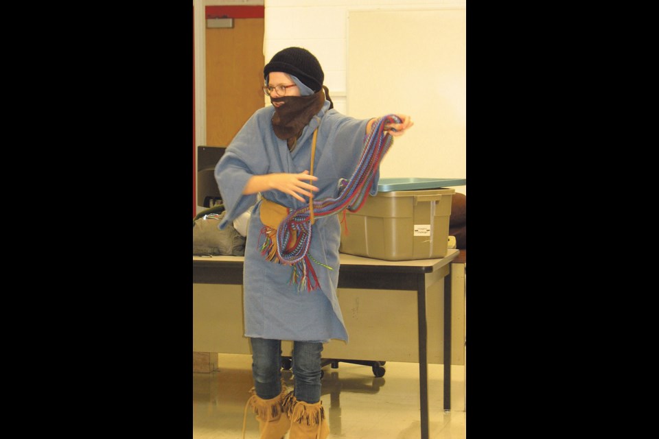 Two teams of students compete in "Dressing the Voyageur". The person dressing the voyageur was blindfolded and the person being dressed was to act as a mannequin.