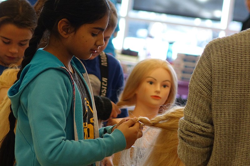 Serenepreet Kuar from École Riverside School practises hairstyling during the Trades & Technology Olympics at the Thomson Regional Community Centre Nov. 21.