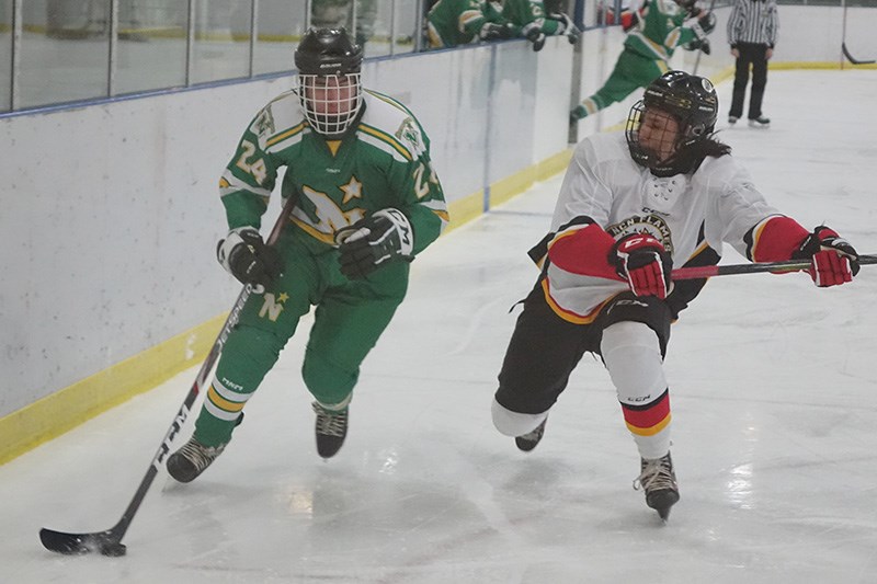 William Young, right, seen here in a Nov. 15 game against the Norway House North Stars in Thompson,