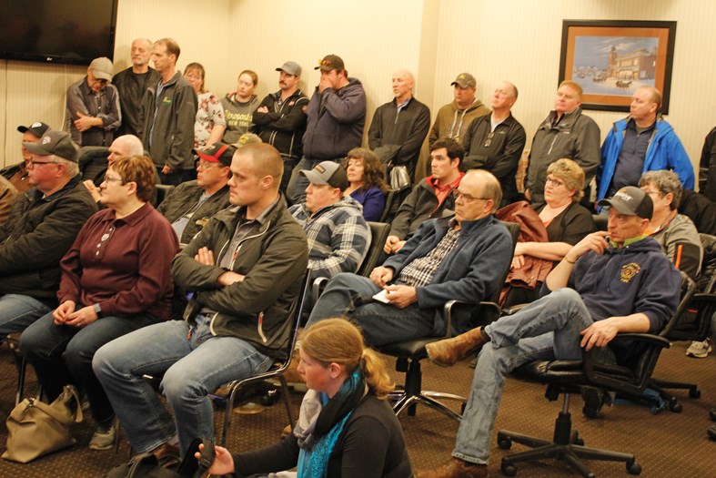 An attentive crowd at the information meeting includes Morris Sales & Service former customers and employees, plus business people and municipal elected officials.