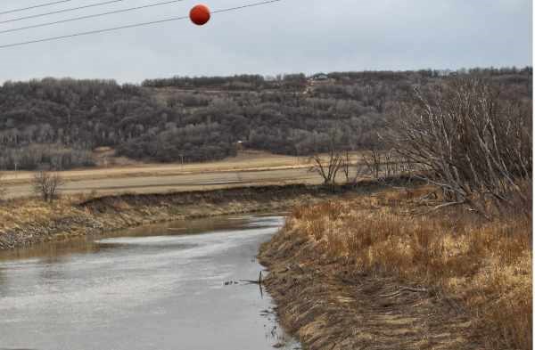 A very low flow in the evening of April 27 on the Assiniboine River just south of Miniota is expected to change as water from Shellmouth dam makes its way down, from a release on Monday, Apr. 27.