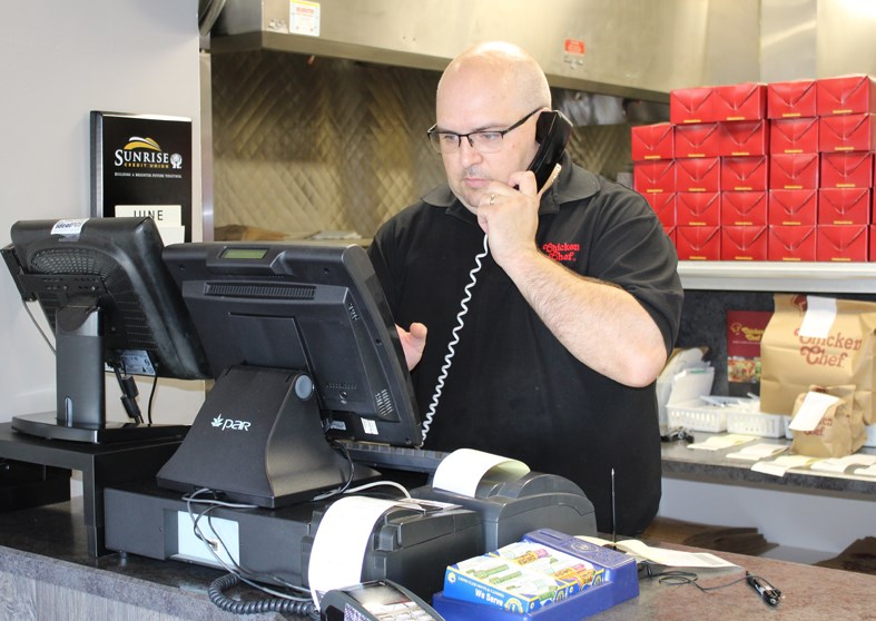 Chicken Chef owner Bruce Barkley taking phone orders at lunchtime on Friday, June 5.