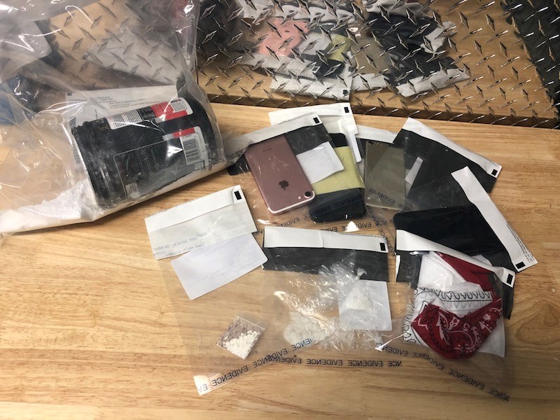 Thompson RCMP arrested two people and seized cocaine, cash and weapons after executing a search warr