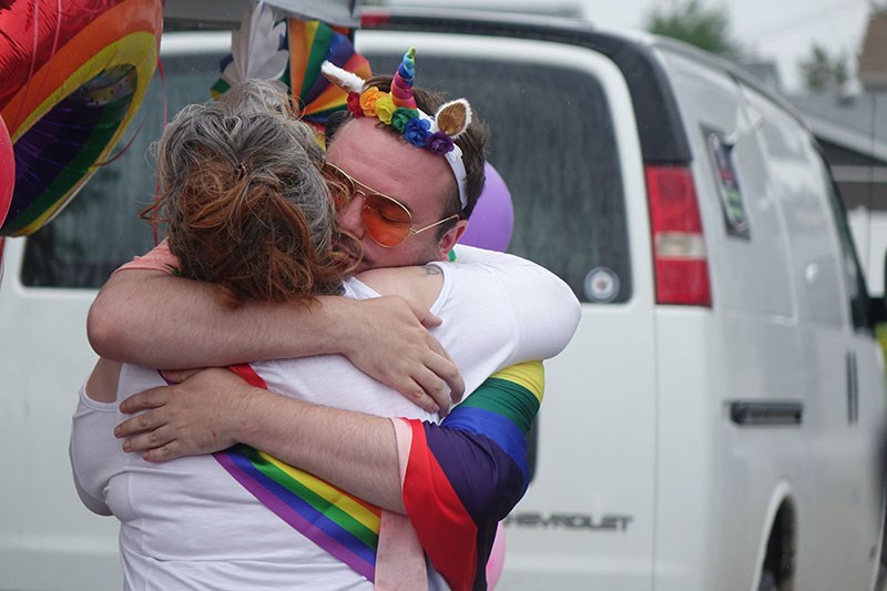 Shyanna Lynxleg and Joshua Steven hug during the Diversity Is Our Strength Celebrating Pride Event in Thompson June 25.