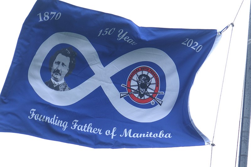 The Métis flag celebrating Manitoba’s founding father Louis Riel and the province’s 150th anniversary flies on the flagpole outside Thompson City Hall July 15.