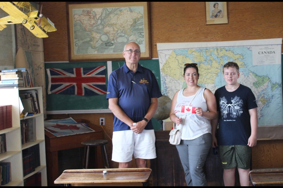 Kelvon Smith, Angela Rookes and Connor Carvey. Smith, a retired teacher from Virden, volunteered at the Manitoba Antique Auto Museum for Elkhorn's Canada Day events, touring visitors through the one-room schoolhouse.