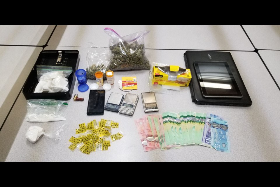 The Pas RCMP seized more than 400 grams of cocaine, 225 grams of marijuana, 327 illicit pills and over $2,000 cash while executing search warrants at two residences Sept. 9.