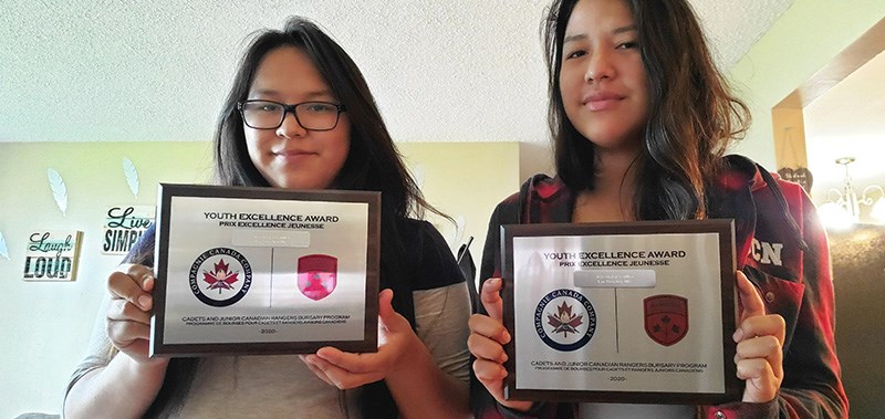 Taylor Veuillot, pictured left, and Skylar Veuillot pose with the plaques they received as recipients of this year’s Canada Company Cadets and Junior Canadian Rangers Bursary. The twin sisters, master corporals with the Lac Brochet Junior Canadian Ranger Patrol, both began their bachelor of arts degrees at the University College of the North in Thompson this fall.