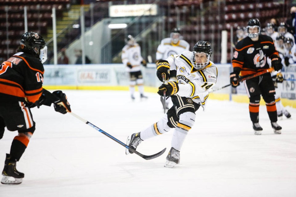 Grizzlies play Nanaimo, Josephs clears the puck.