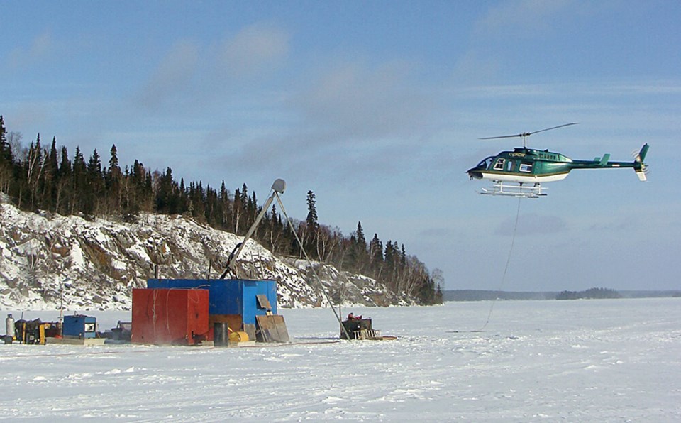 A helicopter provides support for exploration activities at Wolfden Resources Corporation’s Rice Isl