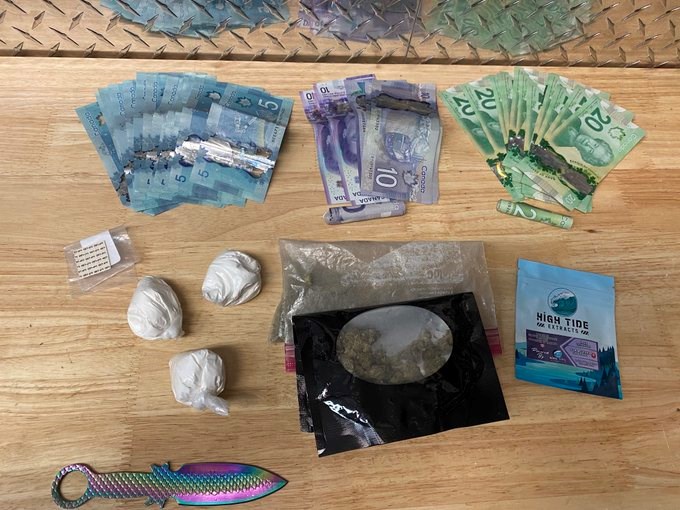 Cocaine, LSD, cash and weapons were seized by Thompson RCMP when they searched a Split Lake home Apr