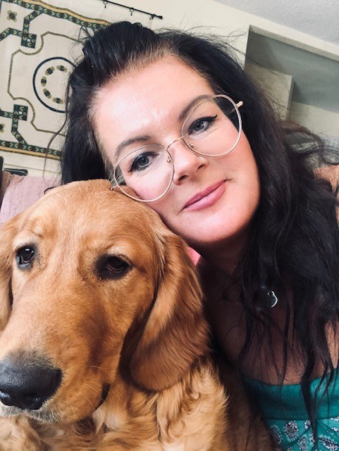 Carla Antichow and her golden retriever Remi.