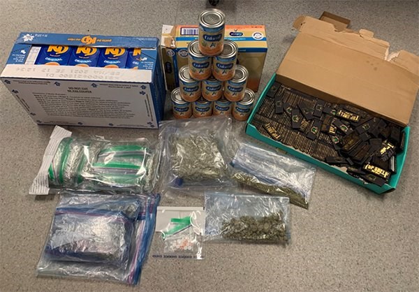 Thompson RCMP seized Kraft Dinner boxes concealing marijuana and baby formula cans filled with alcohol that were being shipped to Nisichawayasihk Cree Nation by a delivery service April 15.