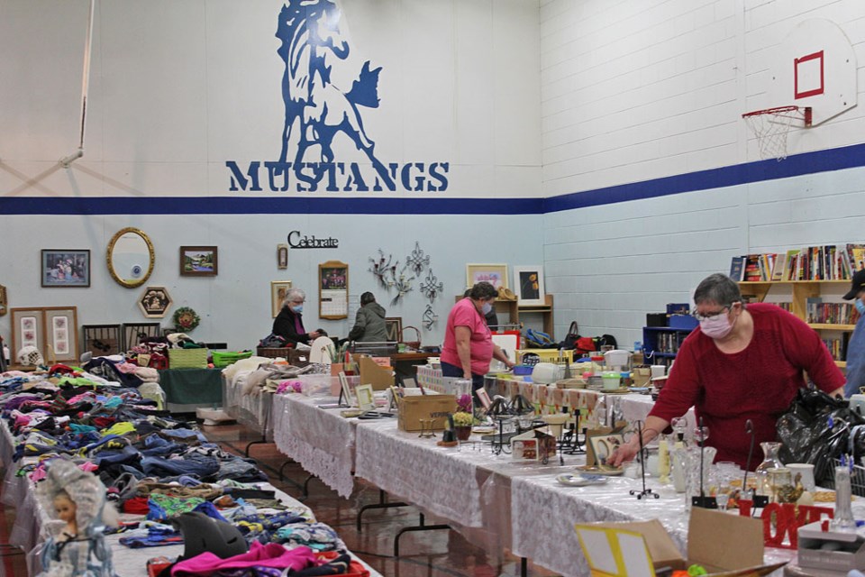 Inside what was once the gym at McAuley, patrons check out the deals to find that just right piece to re-purpose.
