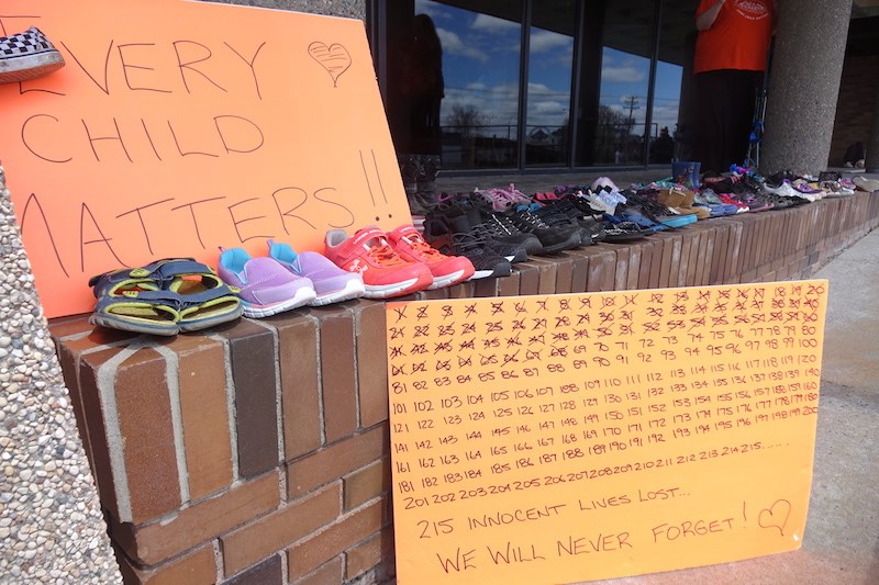 215 pairs of shoes were placed at Thompson City Hall May 30 to remember the 215 Indigenous children whose remains were located at at a former residential school in Kamloops, B.C. last week.