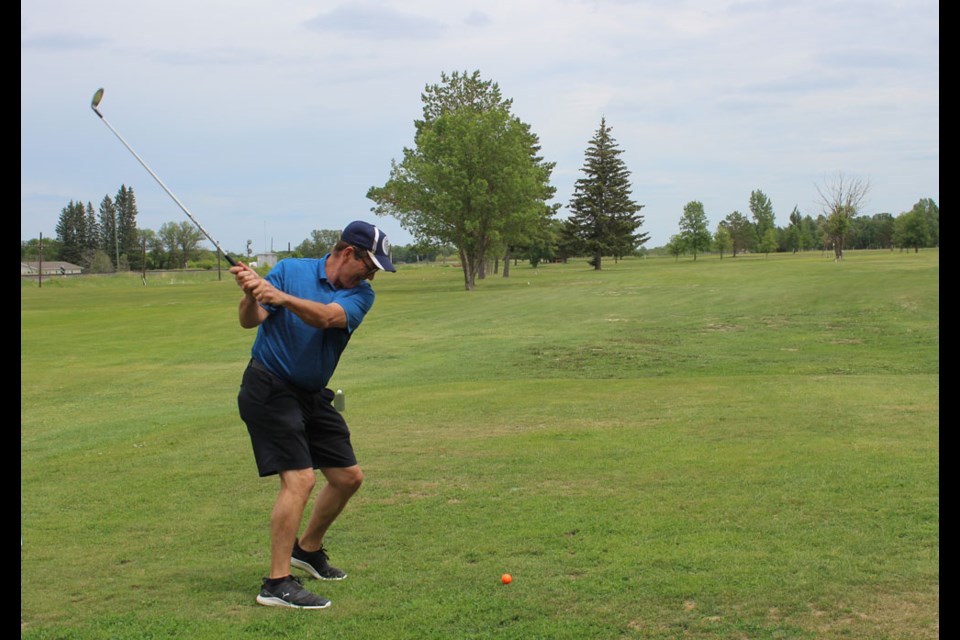 Teeing off on hole 1, this golfer stopped at Oak Lake golf course on his way from Virden back to Brandon.