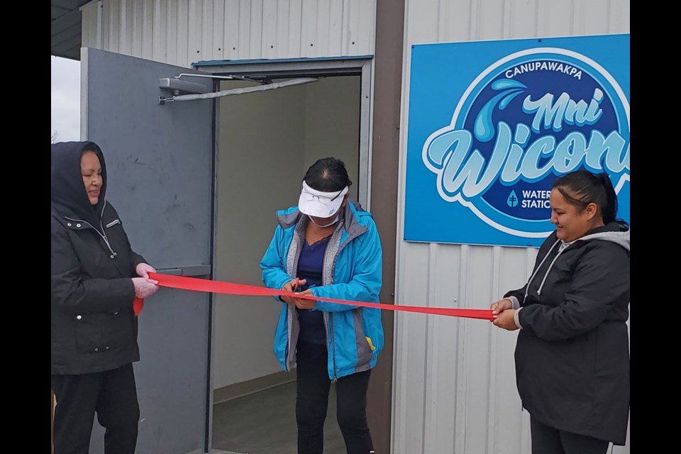 Connie Hieagle (l) is the Canupawakpa Health Representative, Jesse Brown (r) is the Health Liason and community member Jenny Bell cut the ribbon.