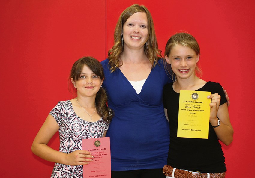 (l-r) Kassidy Johnson with her Most Diligent award, Grade 4 teacher Ms. Howard, and Most Improved award winner Sara Chant.