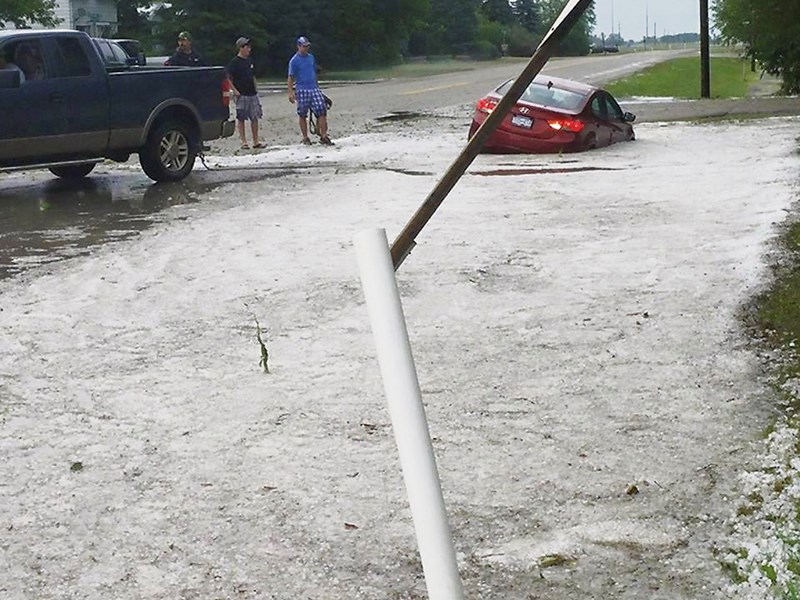 This little car sits in a drainage ditch on Richhill Avenue, in Elkhorn, July 4. The car was pulled to safety by local Elkhorn people. The couple was shaken but unhurt.