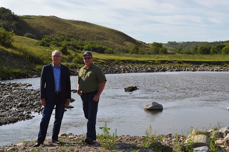 MP Larry Maguire with West Souris River Conservation Manager, Dean Brooker, at the Pipestone Creek.