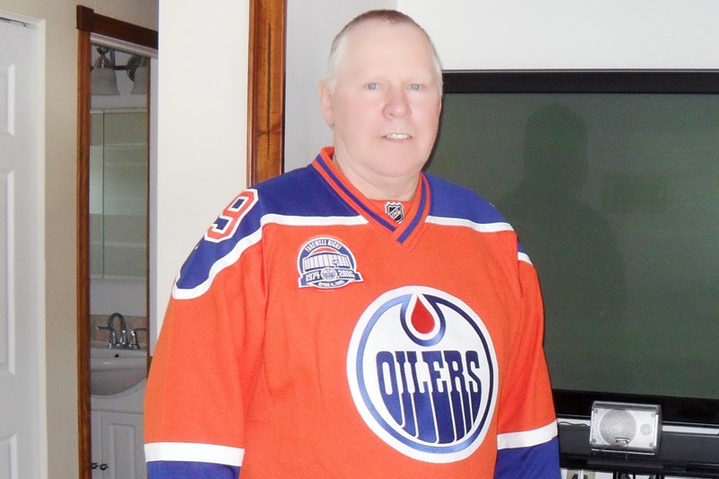 Former Edmonton Oiler and longtime Snow Lake resident Ken Baird wearing his commemorative Oilers jersey.
