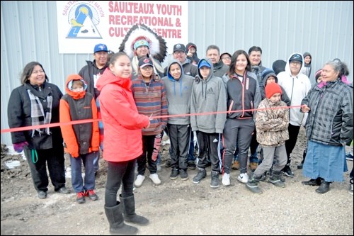 The ribbon is cut to officially open the Saulteaux Youth Recreation Cultural Centre. The project began construction last October.