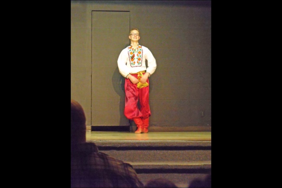 Carson Derksen performing a lively Ukrainian dance March 8.