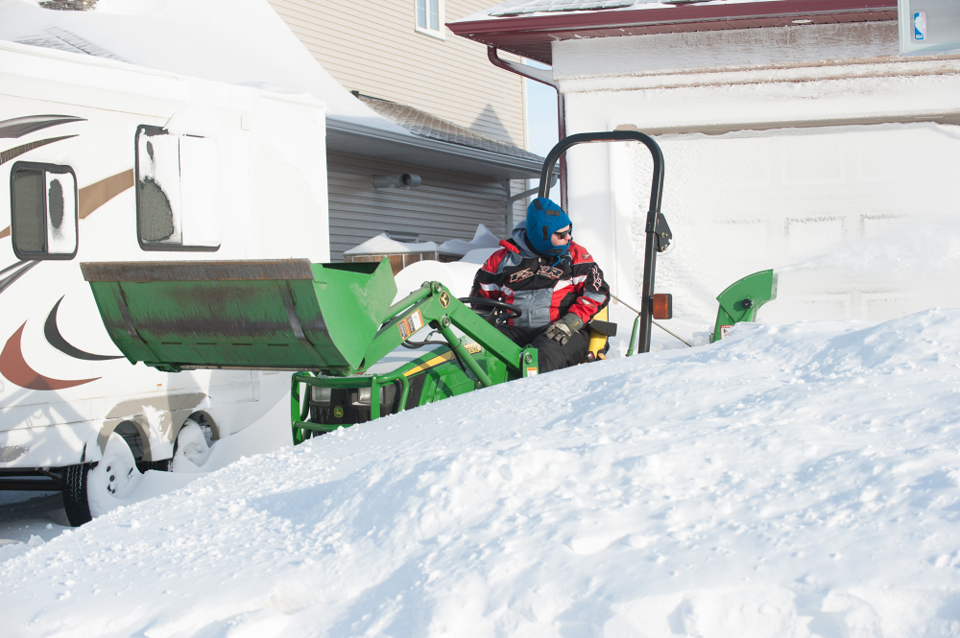 Josh Biggs helped clear snow from a residence on Wellock Road on March 8, one day after a blizzard h