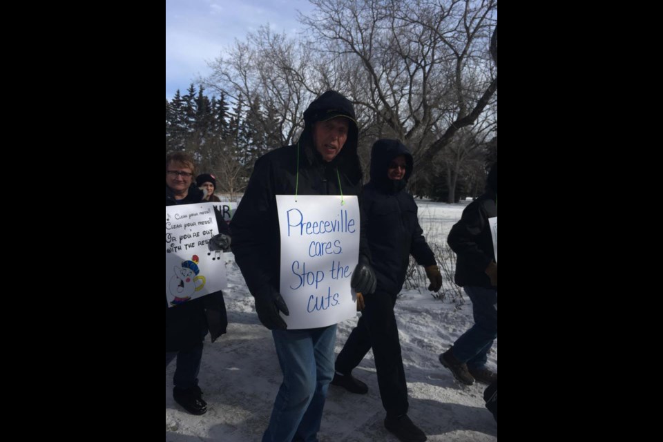 Edgar Thorson of Preeceville marched in front of the Legislative Building in Regina. He marched in the late 1960s for Medicare and again on March 8. From left, were: Cheryl Strelezki, Thorson and Henry Peters.