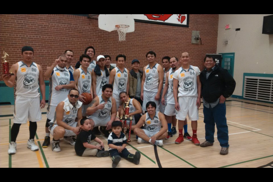 Members of the Preeceville Boars, an all-Filipino basketball team, which won the all-Filipino championship, from left, are: (back row) Alfie Jaway (tournament MVP), Bernie Divina, Jesse Santos, Tommy Trinidad, Rovic Javelona, Ricky Irlandez, Jaycarr dela Torre, Bernabe Lagrama, Jippy Viran, Paul Barnachea, Gregorio Roguel, Roland Ferrenal, Kerwin Sarto and Ariel Vargas, and (front) Rosendo Anguluan, John Ray Algabre, Ian Redoblado, and Manny Villar.