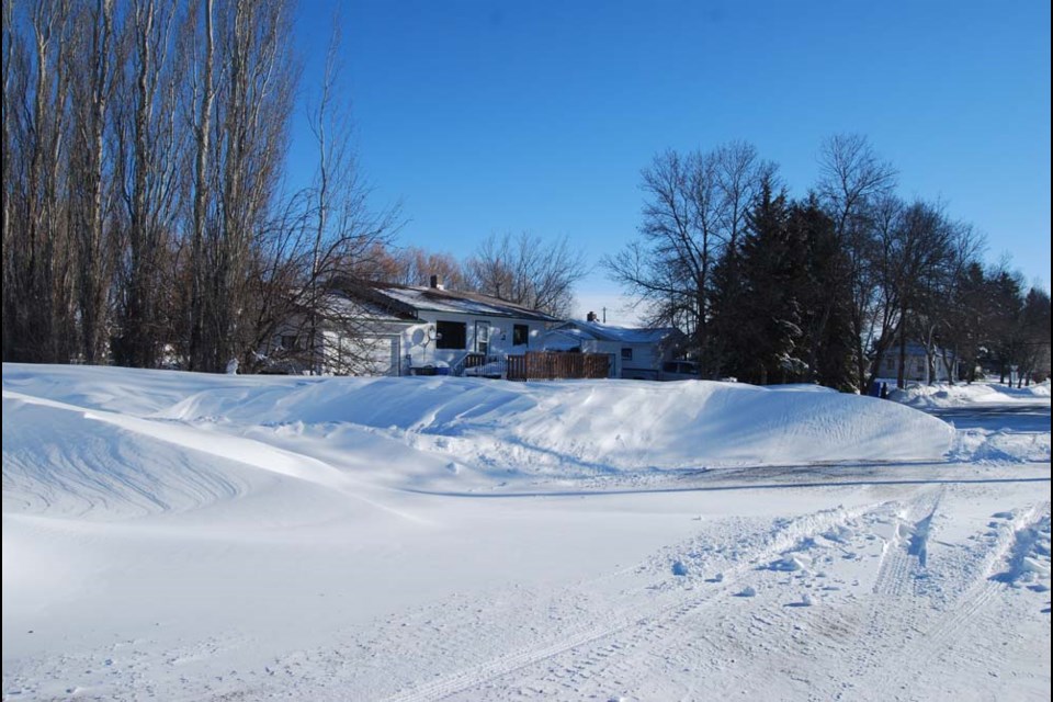 Large snowbanks, like this one on Roslyn Road in Canora, developed during the winter blizzard that struck the area on March 6 and 7