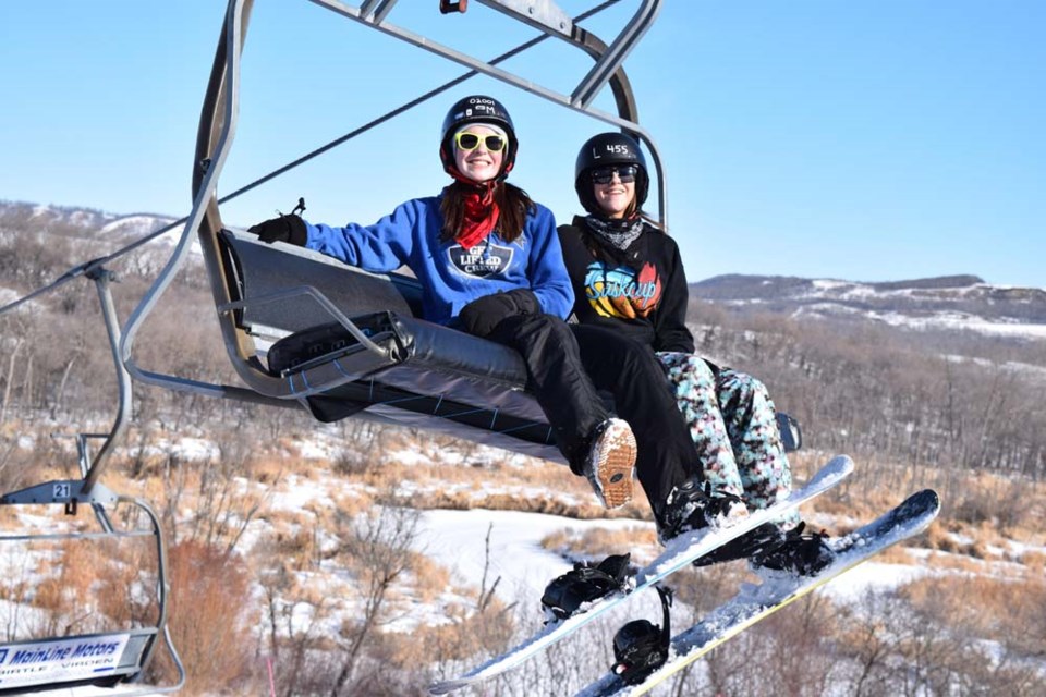 Shayna Dubas and Ellyshia Enge were photographed riding the chair lift at the Asessippi Ski Resort on February 15.