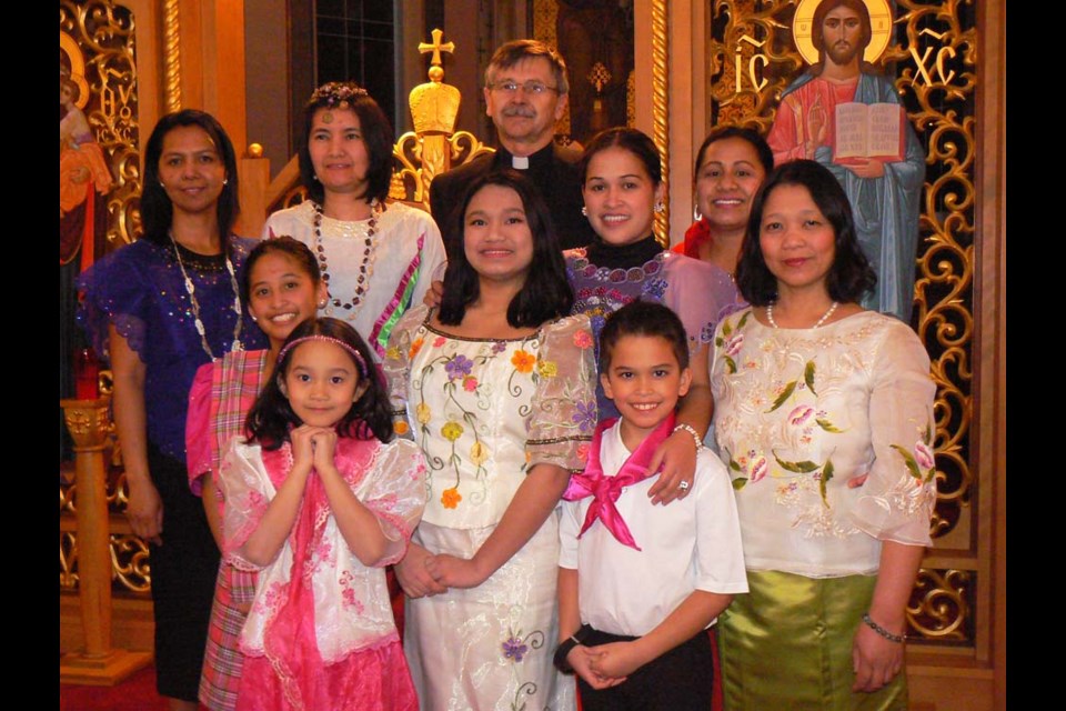 Participated in World Day of Prayer service at Ss. Peter and Paul Ukrainian Catholic Church on March 3, from left, were: (back row) Loujen Cudal, Marieta Napinas, Rev. Fr. J. Rac and Jocelyn Anaka; (middle) Methyl Trask, Hannah Sevilla, Norma Trask and Melinda Sevella, and (front) Hannelle Sevilla and Liam Trask.