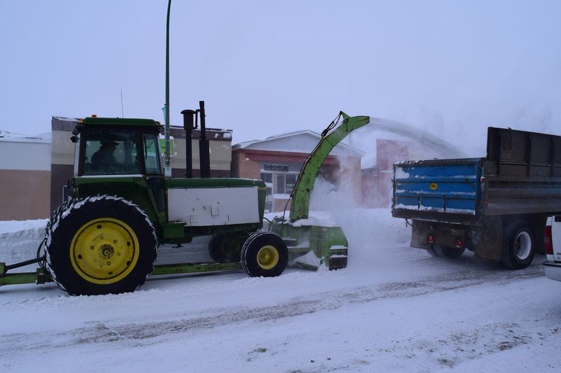 Snow removal was in full swing on the town’s main artery on March 7, even though the storm was still in full force.