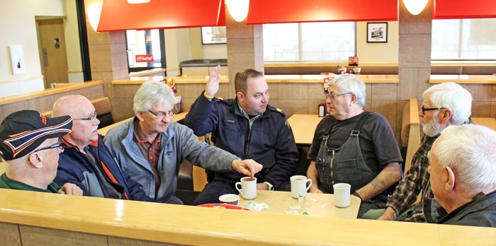 Coffee with Cops Staff Sergeant Jeff Simpson, commander of the Yorkton RCMP municipal detachment chats with members of the public at Dairy Queen Thursday morning. The meeting was the inaugural edition of a new community policing initiative dubbed “Coffee with Cops” designed to foster ties between residents and police and vice versa. “We want to show the community we’re here, we’re in the community, our kids go to the same schools as [yours], we walk our dogs in the same parks, we grocery shop at the local stores,” said Cst. Kristen Guspodarchuk. “We want to be approachable to people.” She said community outreach is part and parcel of the job of policing. Dairy Queen will host every month on the third Thursday, while McDonalds will host on the first Thursday starting April 6 from 10 a.m. to 11:30 a.m. Both establishments are footing the bill for the coffee. Coffee with Cops started in the United States in 2011 and has since spread to many police services in Canada including big cities such as Montreal and Toronto.