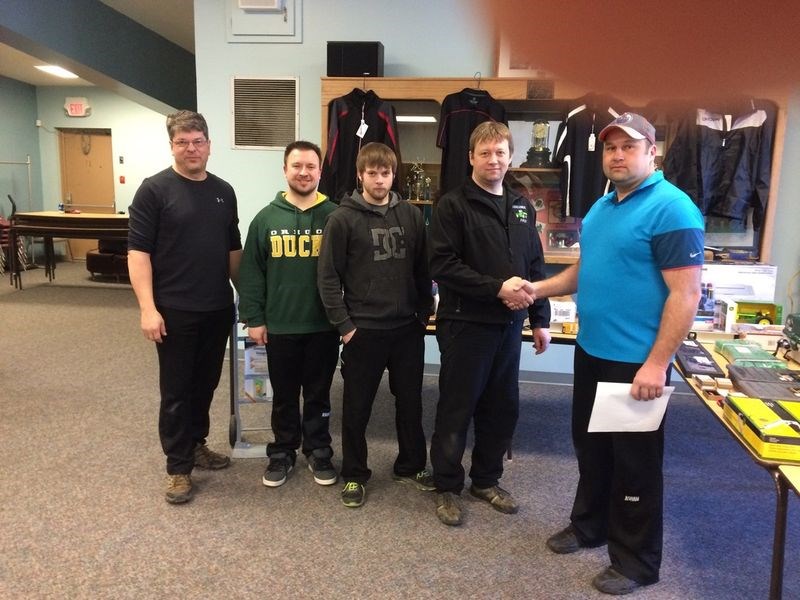 John Zbitniff, right, vice-president of the Canora Curling Club, congratulated the Ken Newell rink of Norquay for having won the A event of the Canora Men’s Bonspiel played March 8 to 12. Members of the winning rink, from left, were: Kevin Ebert, Evan Rostoski, Zach Newell and Ken Newell.