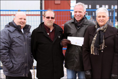 The Victoria Inn, on behalf of Genesis Hospitality, presented the Northern Regional Health Foundation with a $25,000 donation for the new emergency department at Flin Flon General Hospital. Pictured from left: Genesis executive president Kevin Swark, Victoria Inn general manager David Brooks, Northern Regional Health Foundation chairman Brent Lethbridge and Northern Health Region executive director of clinical services Lois Moberly. - PHOTO BY ERIC WESTHAVER