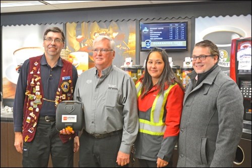 Pictured with the new automated external defibrillator installed at the Discovery Co-op’s Carlton Trail location are Co-op employee and Lions Club treasurer Brian Frijouf; Dave Rogers, manager of the Co-op gas bar; Co-op gas bar employee Jenn Szeto; and Discovery Co-op General Manager Mike Nord. Photos by Shannon Kovalsky
