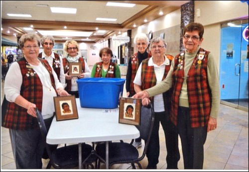 The North Battleford Bonaventure Lions held a raffle on a set of three petite point pictures by the late Eva Lister. Luck of the Irish was with Sid Waters when the draw was made March 17 at the Discovery Co-op mall. Pictured are Lions Gale Morgan, Linda Laycock, Yvonne Nyholt, Naty Kes, Dora Johnson, Gwen Laughlin and Darrallene Lapp. Photo submitted