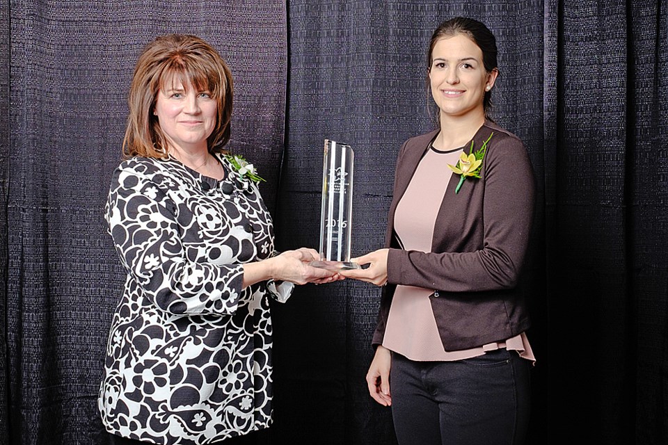 Angela Schmitt, left, the co-owner of Redwillow Outfitting, receives the Fred Heal Tourism Ambassador Award for her efforts to promote tourism at the 28th annual Saskatchewan Tourism Awards of Excellence Gala April 5. Submitted Photo/Tourism Saskatchewan