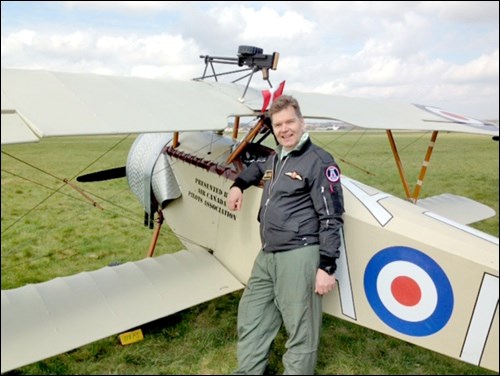 Gordon Cooper with the First World War bi-plane replica he flew over Vimy Ridge on April 9.
