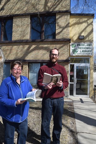 On April 8 Carol Marriott, literacy co-ordinator for the provincial library and literacy office, was part of a province-wide peaceful protest held to draw attention to the severe budget cuts to library funding made by the Saskatchewan Party government in its spring budget. Reading books in front of the Kamsack Public Library to show their support for the provincial library system were Marriott and Robin Newman, a visitor from London, England, staying at Ravenheart Farms near Kamsack.