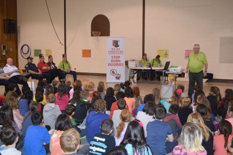 Ken Eskdale of Regina, the Stop Burn Injuries chair and instructor for the Wa Wa Shriners, made a presentation regarding burn care for students at Victoria School in Kamsack on April 5. Joing Eskdale at the presentation, seated from left, were: Jim Pollock, fire chief; Ken Thompson of the Kamsack fire department; and Shriners Glen Boychuk and Al Makowsky of Kamsack; Lloyd Ramsdell and Ron Heal of Regina, and Leroy Charbonneau of Theodore.