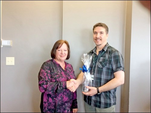Alan Corbeil is recognized as Champions of Mental Health Employee. He is presented his nomination gift by Lucy Bendall. Photos submitted