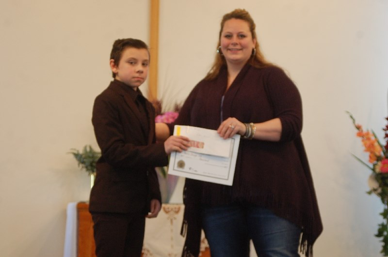 Peter Michl, left, of Canora received a scholarship from Shannon Nelson.